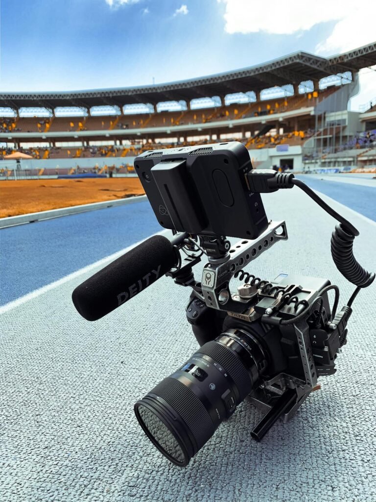Professional camera capturing fast-moving sports action with high-speed autofocus